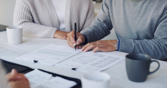 A couple signing a document