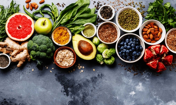 A colorful assortment of fruits and vegetables neatly arranged in bowls. A healthy and vibrant display of nature's bounty.