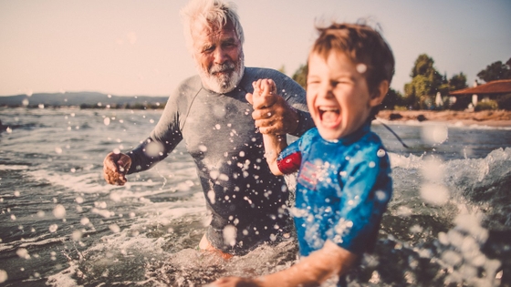 father and son having fun in the water
