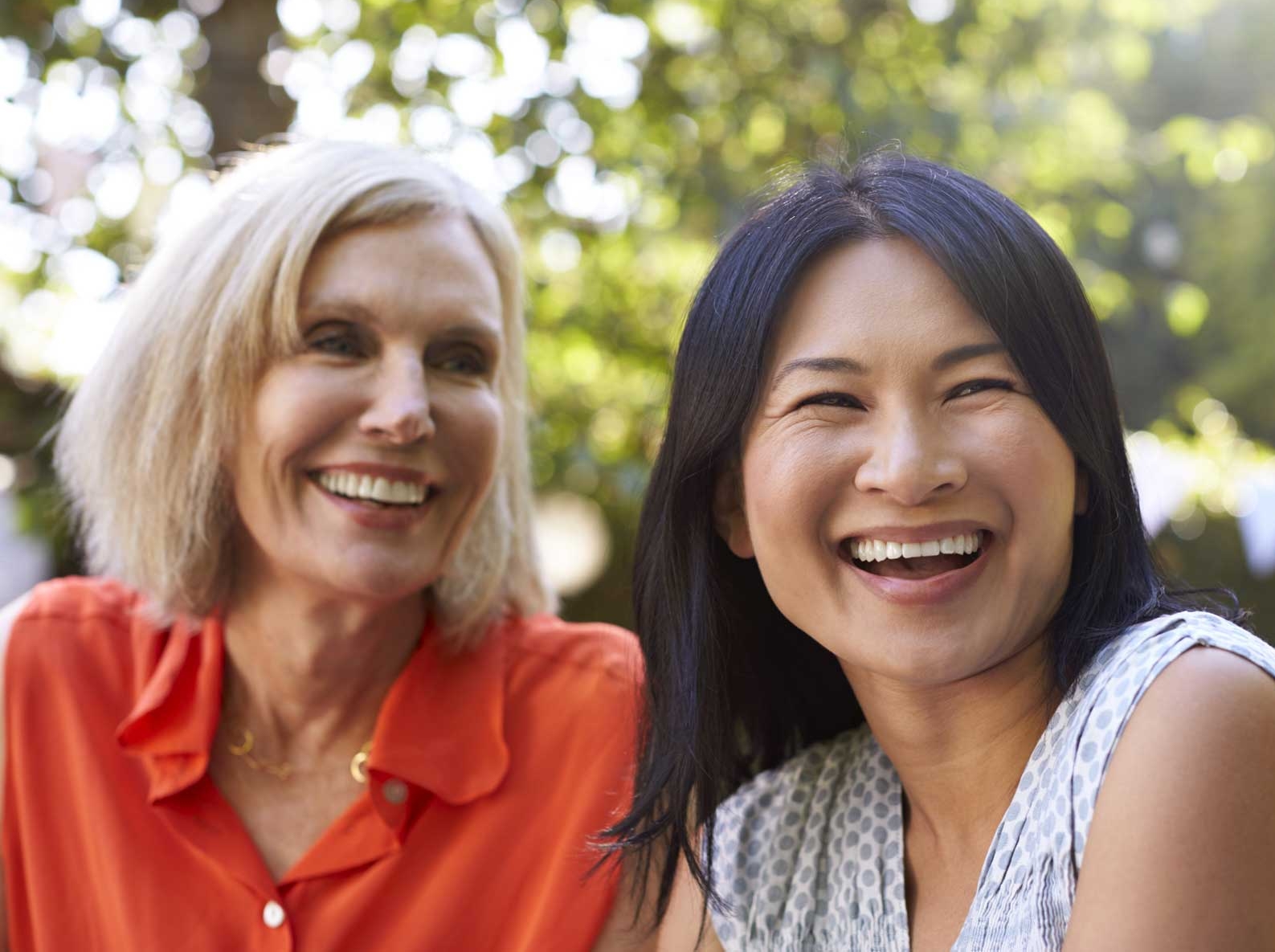 Group of women smiling (mixed backgrounds)
